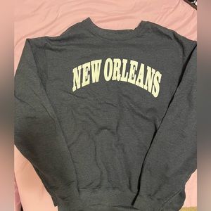 New Orleans sweatshirt, bought at gift shop. Navy blue, with white lettering.